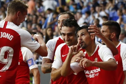 Sevilla's Nolito, 2nd from right, celebrates with team mates after scoring his side's second goal during the Spanish La Liga soccer match between Espanyol and Sevilla at the RCDE Stadium in Barcelona, Spain, Sunday Aug.18, 2019. (AP Photo/Joan Monfort)