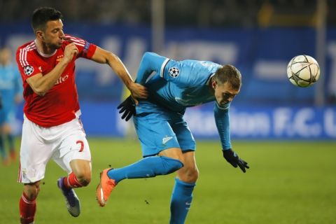 Benficas Andreas Samaris, left, and Zenit's Artyom Dzyuba head for the ball during their Champions League League Round of 16 second leg soccer match between Zenit and Benfica at Petrovsky stadium in St.Petersburg, Russia, Wednesday, March 9, 2016. (AP Photo/Dmitri Lovetsky)