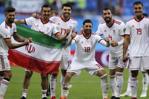 Iran's players celebrate their victory after the group B match between Morocco and Iran at the 2018 soccer World Cup in the St. Petersburg Stadium in St. Petersburg, Russia, Friday, June 15, 2018. (AP Photo/Themba Hadebe)