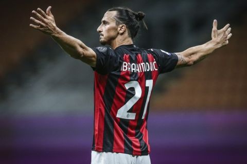 Milan's Zlatan Ibrahimovic celebrates after scoring the second goal during a Serie A soccer match between Milan and Cagliari, at the Giuseppe Meazza stadium in Milan, Italy, Saturday, Aug. 1, 2020. (Spada/LaPresse via AP)