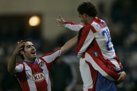 Atletico Madrid soccer player Simao, from Portugal, is congratulated by teammate Antonio Lopez, left, after scoring against Aberdeen FC during their group B UEFA Cup match at Vicente Calderon stadium in Madrid, Thursday Nov. 29 2007. (AP Photo/Bernat Armangue)