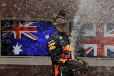 Red Bull driver Daniel Ricciardo of Australia celebrates on the podium after winning the Formula One race, at the Monaco racetrack, in Monaco, Sunday, May 27, 2018. (AP Photo/Claude Paris)