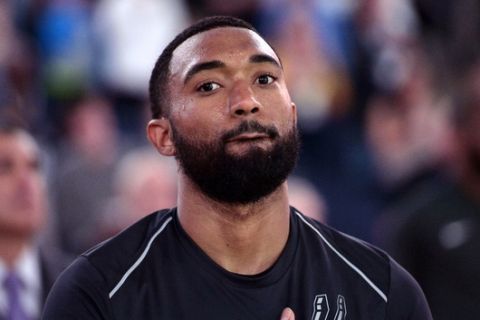 San Antonio Spurs guard Darrun Hilliard stands on the court during player introductions before an NBA basketball game against the Memphis Grizzlies Wednesday, Jan. 24, 2018, in Memphis, Tenn. (AP Photo/Brandon Dill)
