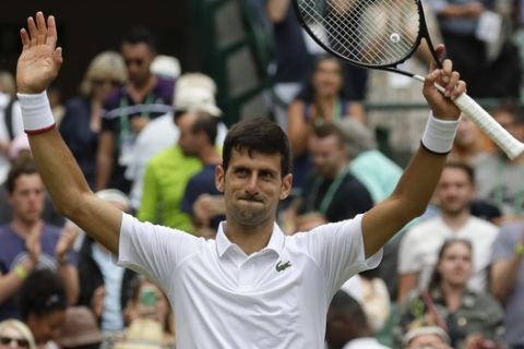 Serbia's Novak Djokovic celebrates defeating Ugo Humbert of France in a men's singles match during day seven of the Wimbledon Tennis Championships in London, Monday, July 8, 2019. (AP Photo/Kirsty Wigglesworth)