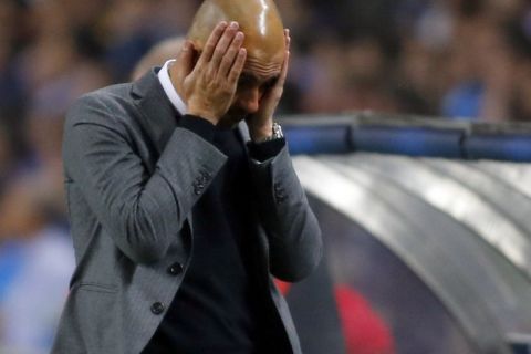 Bayern Munich's coach Pep Guardiola reacts during their Champions League quarterfinal first leg soccer match against Porto at Dragao stadium in Porto April 15, 2015.   REUTERS/Miguel Vidal  - RTR4XI6G