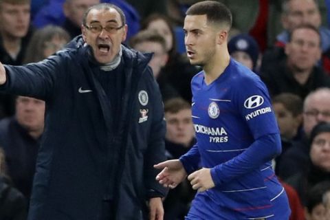 Chelsea's team manager Maurizio Sarri gives instructions to Chelsea's Eden Hazard, right, during the English Premier League soccer match between Chelsea and Leicester City at Stamford Bridge stadium in London, Saturday, Dec. 22, 2018.(AP Photo/Frank Augstein)