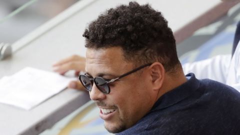FILE  - In this  June 30, 2018, Brazil's former player Ronaldo watches a match between France and Argentina,at the 2018 soccer World Cup at the Kazan Arena in Kazan, Russia. Ronaldo said on Sunday, Aug. 12, 2018 that he has been hospitalized since Friday because of flu, and expects to return home on Monday. (AP Photo/Sergei Grits, File)