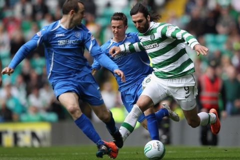 GLASGOW, SCOTLAND - APRIL 01:  Georgios Samaras of Celtic in action against Chris Millar of St Johnstone during the Scottish Clydesdale Bank Scottish Premier League match between Celtic and St Johnstone at Celtic Park on April 1, 2012 in Glasgow, Scotland.  (Photo by Jeff J Mitchell/Getty Images)