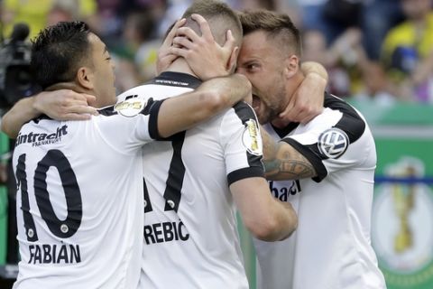 Frankfurt's scorer Ante Rebic, center, and his teammates Marco Fabian, left, and Haris Seferovic, right, celebrate their side's first goal during the German soccer cup final match between Borussia Dortmund and Eintracht Frankfurt in Berlin, Germany, Saturday, May 27, 2017. (AP Photo/Michael Sohn)