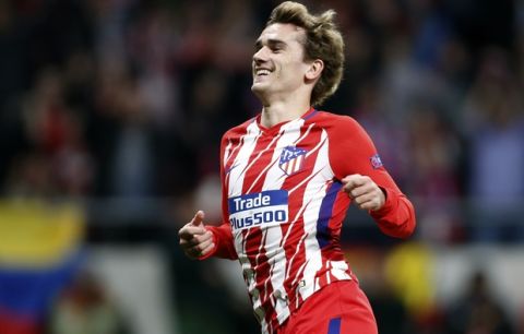 Atletico's Antoine Griezmann celebrates after scoring his side's second goal during the Europa League quarterfinal first leg soccer match between Atletico Madrid and Sporting CP at the Metropolitano stadium in Madrid, Thursday, April 5, 2018. (AP Photo/Francisco Seco)