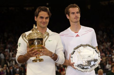 LONDON, ENGLAND - JULY 08:  Winner Roger Federer of Switzerland and  runner up Andy Murray of Great Britain hold up their trophies after their Gentlemen's Singles final match on day thirteen of the Wimbledon Lawn Tennis Championships at the All England Lawn Tennis and Croquet Club on July 8, 2012 in London, England.  (Photo by Clive Brunskill/Getty Images)