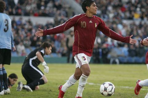 Venezuela's Ronald Vargas celebrates after scoring a goal against Uruguay during a World Cup 2010 qualifying soccer match in Montevideo, Saturday, June 14, 2008. (AP Photo/Alejandro Arigon)