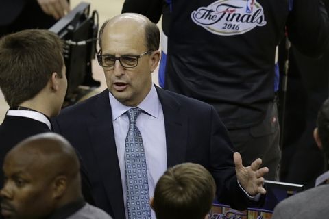 FILE - In this June 2, 2016, file photo, television announcer Jeff Van Gundy speaks before Game 1 of basketball's NBA Finals between the Golden State Warriors and the Cleveland Cavaliers,  in Oakland, Calif. Former NBA coach Jeff Van Gundy will lead the U.S. mens basketball team through the early stages of qualifying for the 2019 Basketball World Cup. He will guide a team made up of mostly NBA G League players in this summers FIBA AmeriCup 2017 tournament and in qualifying games between November and September 2018. USA Basketball announced Van Gundys appointment Wednesday, July 5, 2017. (AP Photo/Ben Margot, File)