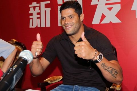 Brazilian soccer star Hulk gives a thumbs-up at a press conference in Shanghai Friday, July 1, 2016. Shanghai SIPG signed Brazilian forward Hulk from Zenit St. Petersburg for an Asia transfer record $62 million on Thursday. (Color China Photo via AP) CHINA OUT