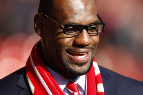 U.S. and Miami Heat basketball player LeBron James looks on before the English Premier League soccer match between Liverpool and Manchester United at Anfield, Liverpool, England, Saturday Oct. 15, 2011. (AP Photo/Tim Hales)