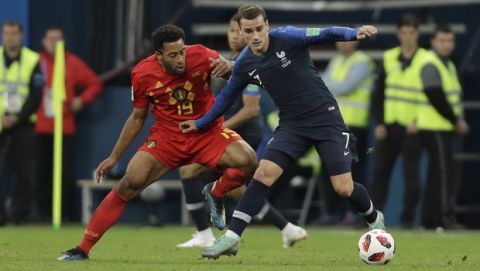 France's Antoine Griezmann, shields the ball from Belgium's Moussa Dembele during the semifinal match between France and Belgium at the 2018 soccer World Cup in the St. Petersburg Stadium in, St. Petersburg, Russia, Tuesday, July 10, 2018. (AP Photo/Natacha Pisarenko)