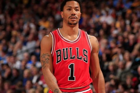 DENVER, CO - NOVEMBER 25:  Derrick Rose #1 of the Chicago Bulls looks on during a break in the action against the Denver Nuggets at Pepsi Center on November 25, 2014 in Denver, Colorado. The Nuggets defeated the Bulls 114-109. NOTE TO USER: User expressly acknowledges and agrees that, by downloading and or using this photograph, User is consenting to the terms and conditions of the Getty Images License Agreement.  (Photo by Doug Pensinger/Getty Images)