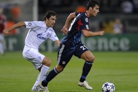 Lyon's French midfielder Yoann Gourcuff (R) fights for the ball against Schalke's Spanish forward Raul (L) during the UEFA Champions League football match Lyon versus Schalke 04 on September 14, 2010 at the Gerland stadium in Lyon, eastern France. AFP PHOTO PHILIPPE DESMAZES (Photo credit should read PHILIPPE DESMAZES/AFP/Getty Images)