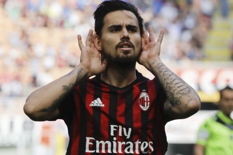 AC Milan's Suso celebrates after scoring the opening goal during a Serie A soccer match between AC Milan and Palermo, at the San Siro stadium in Milan, Italy, Sunday, April 9, 2017. (AP Photo/Luca Bruno)