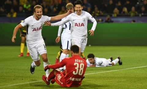 Tottenham's Son Heung-min, right, celebrates after scoring his side's second goal during the soccer Champions League group H match between Borussia Dortmund and Tottenham Hotspur in Dortmund, Germany, Tuesday, Nov. 21, 2017. (AP Photo/Martin Meissner)
