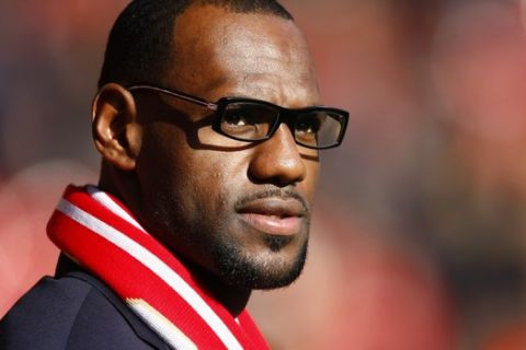 US and Miami Heat basketball player LeBron James looks on before the English Premier League soccer match between Liverpool and Manchester United at Anfield, Liverpool, England, Saturday Oct. 15, 2011. (AP Photo/Tim Hales)