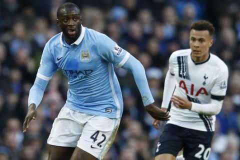 Manchester City's Yaya Toure, left, runs with the ball during the English Premier League soccer match between Manchester City and Tottenham Hotspur's at the Etihad Stadium in Manchester, England, Sunday Feb. 14, 2016. (AP Photo/Jon Super)  