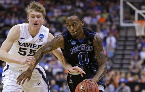 Georgia State guard Kevin Ware (0) drives past Xavier guard J.P. Macura (55) during the first half of an NCAA tournament third round college basketball game, Saturday, March 21, 2015, in Jacksonville, Fla. (AP Photo/Chris O'Meara)