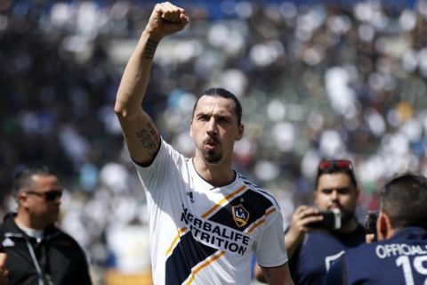 FILE - In this March 31, 2018 file photo Los Angeles Galaxy's Zlatan Ibrahimovic, of Sweden, acknowledges fans as he walks off the field after an MLS soccer match against the Los Angeles FC in Carson, Calif. Ibrahimovic and the LA Galaxy both announced Wednesday, Nov. 13, 2019 they are officially parting ways after two seasons. (AP Photo/Jae C. Hong, file)