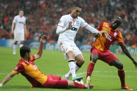 Manchester United's Federico Macheda, center, fights for the ball with Albert Riera, left, and Dany Nounkeu of Galatasaray during their Champions League group H soccer match at TT Arena Stadium in Istanbul, Turkey, Tuesday, Nov. 20, 2012. (AP Photo)