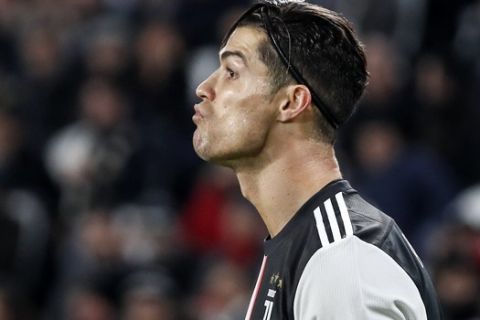 Juventus' Cristiano Ronaldo reacts during the Champions League group D soccer match between Juventus and Atletico Madrid at the Allianz stadium in Turin, Italy, Tuesday, Nov. 26, 2019. (AP Photo/Antonio Calanni)