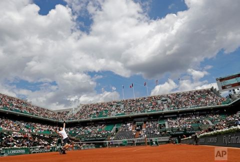 In this Monday, June 5, 2017 photo, Britain's Andy Murray serves against Russia Karen Khachanov during their fourth round match of the French Open tennis tournament at the Roland Garros stadium, in Paris, France. (AP Photo/Petr David Josek)