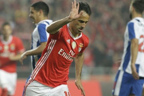 Benfica's Jonas celebrates after scoring the opening goal during a Portuguese league soccer match between Benfica and FC Porto at the Luz stadium in Lisbon, Saturday, April 1, 2017. (AP Photo/Armando Franca)