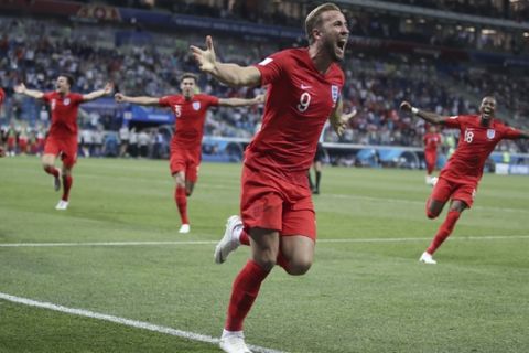 England's Harry Kane, center, celebrates after scoring during the group G match between Tunisia and England at the 2018 soccer World Cup in the Volgograd Arena in Volgograd, Russia, Monday, June 18, 2018. (AP Photo/Thanassis Stavrakis)