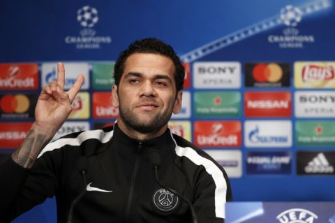 PSG's defender Dani Alves attends a press conference on the eve of the Champions League Round of 16 second leg soccer match between Paris Saint Germain and Real Madrid at the Parc des Princes stadium, in Paris, Monday, March. 5, 2018. (AP Photo/Francois Mori)
