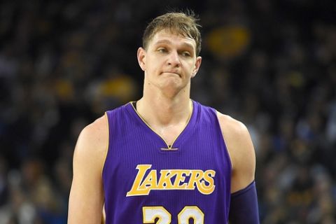 OAKLAND, CA - NOVEMBER 23:  Timofey Mozgov #20 of the Los Angeles Lakers reacts as he walks off the court after picking up his third personl foul against the Golden State Warriors in the first quarter of their NBA basketball game at ORACLE Arena on November 23, 2016 in Oakland, California. NOTE TO USER: User expressly acknowledges and agrees that, by downloading and or using this photograph, User is consenting to the terms and conditions of the Getty Images License Agreement.  (Photo by Thearon W. Henderson/Getty Images)
