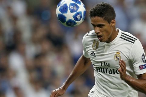 Real defender Raphael Varane heads a ball during a Group G Champions League soccer match between Real Madrid and Roma at the Santiago Bernabeu stadium in Madrid, Spain, Wednesday Sept. 19, 2018. (AP Photo/Manu Fernandez)
