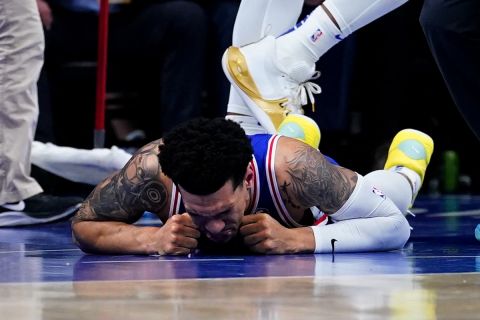 Philadelphia 76ers' Danny Green lays injured on the ground during the first half of Game 6 of an NBA basketball second-round playoff series against the Miami Heat, Thursday, May 12, 2022, in Philadelphia. (AP Photo/Matt Slocum)