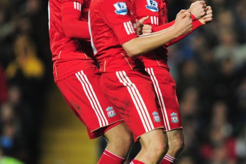 LONDON, UNITED KINGDOM - NOVEMBER 29:  Maxi Rodriguez (R) of Liverpool celebrates the opening goal with team mates during the Carling Cup quarter final match between Chelsea and Liverpool at Stamford Bridge on November 29, 2011 in London, England.  (Photo by Jamie McDonald/Getty Images)