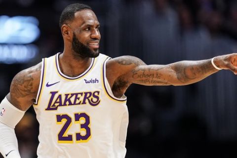 Los Angeles Lakers forward LeBron James celebrates a basket during the second half of the team's NBA basketball game against the Denver Nuggets on Tuesday, Dec. 3, 2019, in Denver. The Lakers won 105-96. (AP Photo/Jack Dempsey)