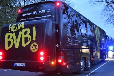 FILE - In this April 11, 2017 file photo a window of Dortmund's team bus is damaged after an explosion before the Champions League quarterfinal soccer match between Borussia Dortmund and AS Monaco in Dortmund, western Germany. German prosecutors have charged a man accused of bombing Borussia Dortmunds team bus in April with attempted  murder. Dortmund prosecutors said they filed the indictment at the citys state court Tuesday Aug. 29, 2017.  (AP Photo/Martin Meissner,file)