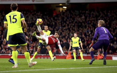 Arsenal's Lucas Torreira scores his side's first goal of the game  during the English Premier League soccer match between Arsenal and Huddersfield, at the Emirates Stadium, London, Saturday, Dec. 8, 2018. (Isabel Infantes/PA via AP)