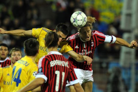 Massimo Ambrosini of AC Milan (R) vies for the ball with Marco Simic of Bate Borisov (L) during their UEFA Champions League Group H football match in Minsk, on November 1, 2011.  AFP PHOTO/ VIKTOR DRACHEV (Photo credit should read VIKTOR DRACHEV/AFP/Getty Images)