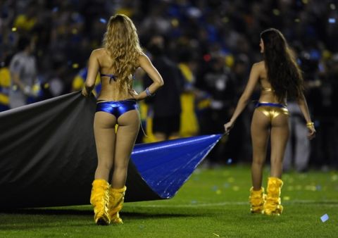 Boca Juniors'  cheerleaders display a flag before their Argentina First Division football match, at La Bombonera stadium in Buenos Aires,  on May 27, 2012. AFP PHOTO / Alejandro PAGNI        (Photo credit should read ALEJANDRO PAGNI/AFP/GettyImages)