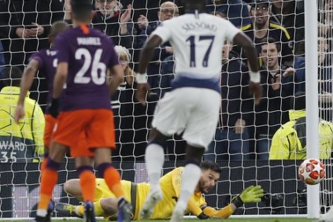 Tottenham's goalkeeper Hugo Lloris saves on a penalty kick by Manchester City's Sergio Aguero during the Champions League, round of 8, first-leg soccer match between Tottenham Hotspur and Manchester City at the Tottenham Hotspur stadium in London, Tuesday, April 9, 2019. (AP Photo/Frank Augstein)