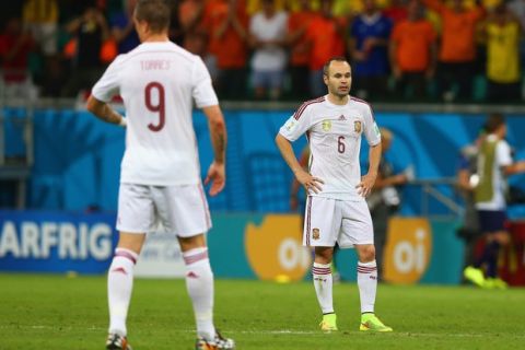 SALVADOR, BRAZIL - JUNE 13:  Fernando Torres of Spain (L) and Andres Iniesta (R)  look dejected during the 2014 FIFA World Cup Brazil Group B match between Spain and Netherlands at Arena Fonte Nova on June 13, 2014 in Salvador, Brazil.  (Photo by Quinn Rooney/Getty Images)