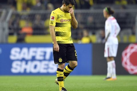 Dortmund's Sokratis leaves the pitch after a red card during the German Bundesliga soccer match between Borussia Dortmund and RB Leipzig in Dortmund, Germany, Saturday, Oct. 14, 2017. (AP Photo/Martin Meissner)
