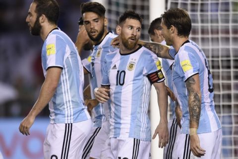 Argentinas Lionel Messi celebrates with teammates after scoring a penalty kick during a 2018 Russia World Cup qualifying soccer match between Argentina and Chile at the Monumental stadium in Buenos Aires, Argentina, Thursday March 23, 2017.(AP Photo/Gustavo Garello)