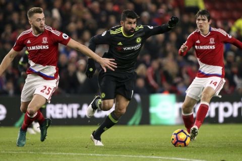 Chelsea's Diego Costa, center, vies for the ball with Middlesbrough's Callum Chambers, left, and Marten De Roon, right, during the English Premier League soccer match between Middlesbrough and Chelsea at the Riverside stadium, Middlesbrough, England, Sunday, Nov. 20, 2016. (AP Photo/Scott Heppell)