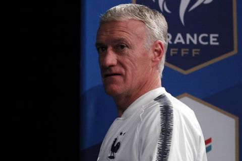 France's head coach Didier Deschamps arrives for a press conference ahead of Tuesday's friendly soccer match between France and Uruguay at Stade De France, in Saint Denis, north of Paris, France, Monday, Nov. 19, 2018. (AP Photo/Francois Mori)