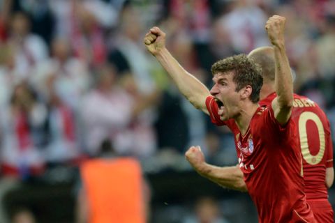 Bayern Munich's German forward Thomas Mueller celebrates after scoring a goal during the UEFA Champions League final football match between FC Bayern Muenchen and Chelsea FC on May 19, 2012 at the Fussball Arena stadium in Munich. AFP PHOTO / ODD ANDERSENODD ANDERSEN/AFP/GettyImages